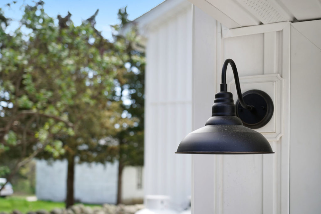 Exterior light with black trim on a white building