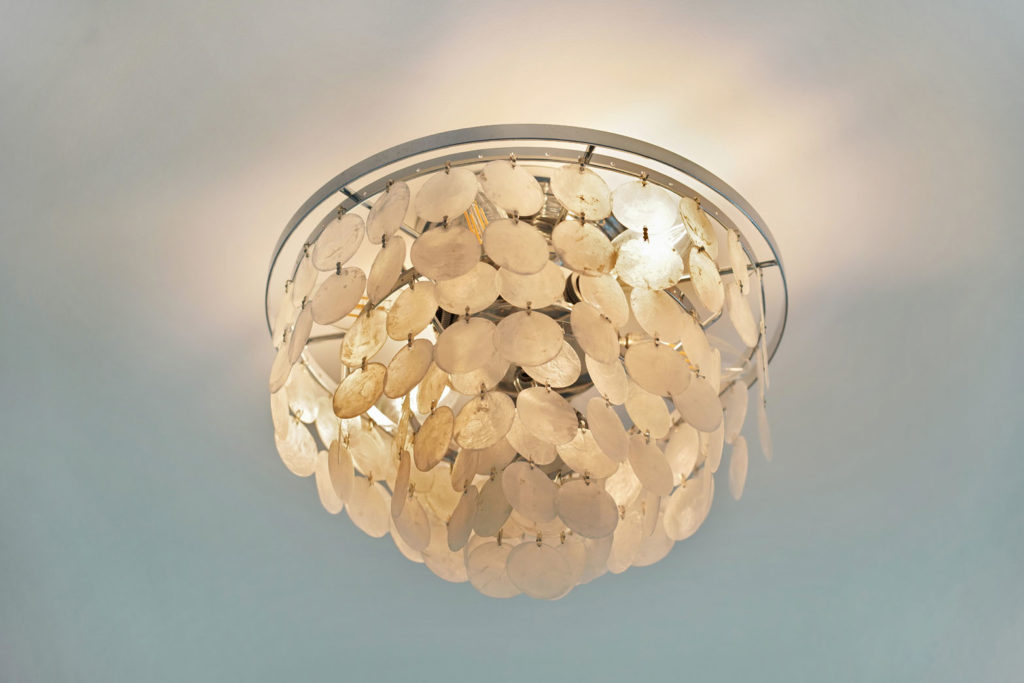 Illuminated round ceiling light with hanging layered paper lamp shades