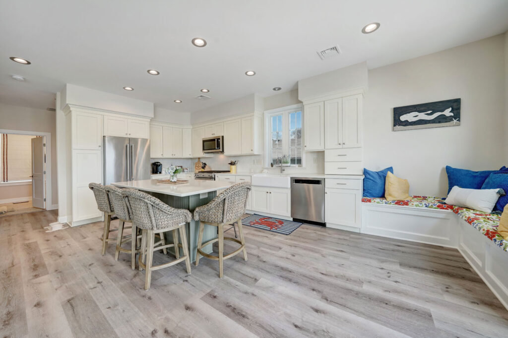 kitchen with a marble island and a corner seating nook