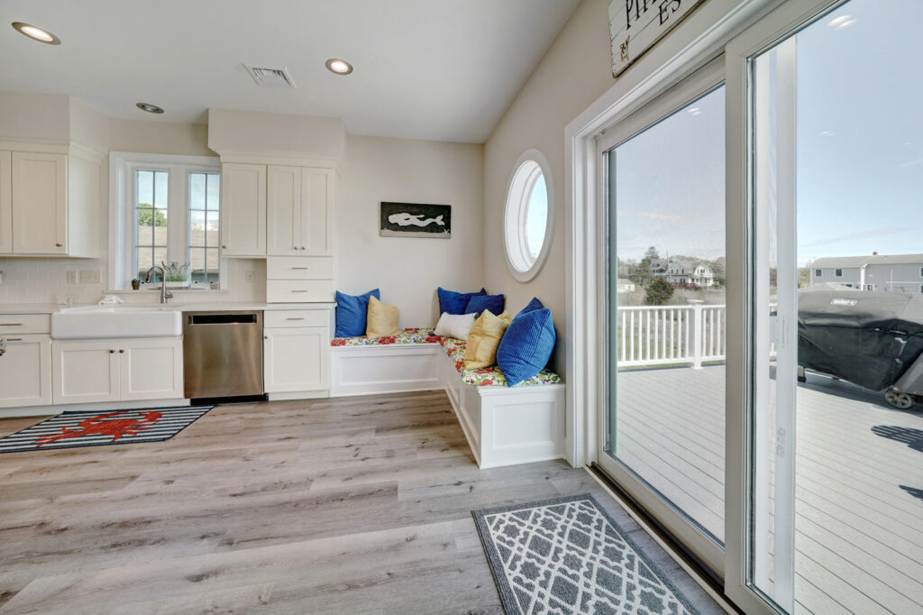 a seating nook in the corner of a modern kitchen