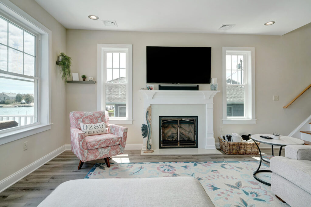A living room addition filled with furniture and a flat screen tv built by Fidero & Sons in Meriden, CT.