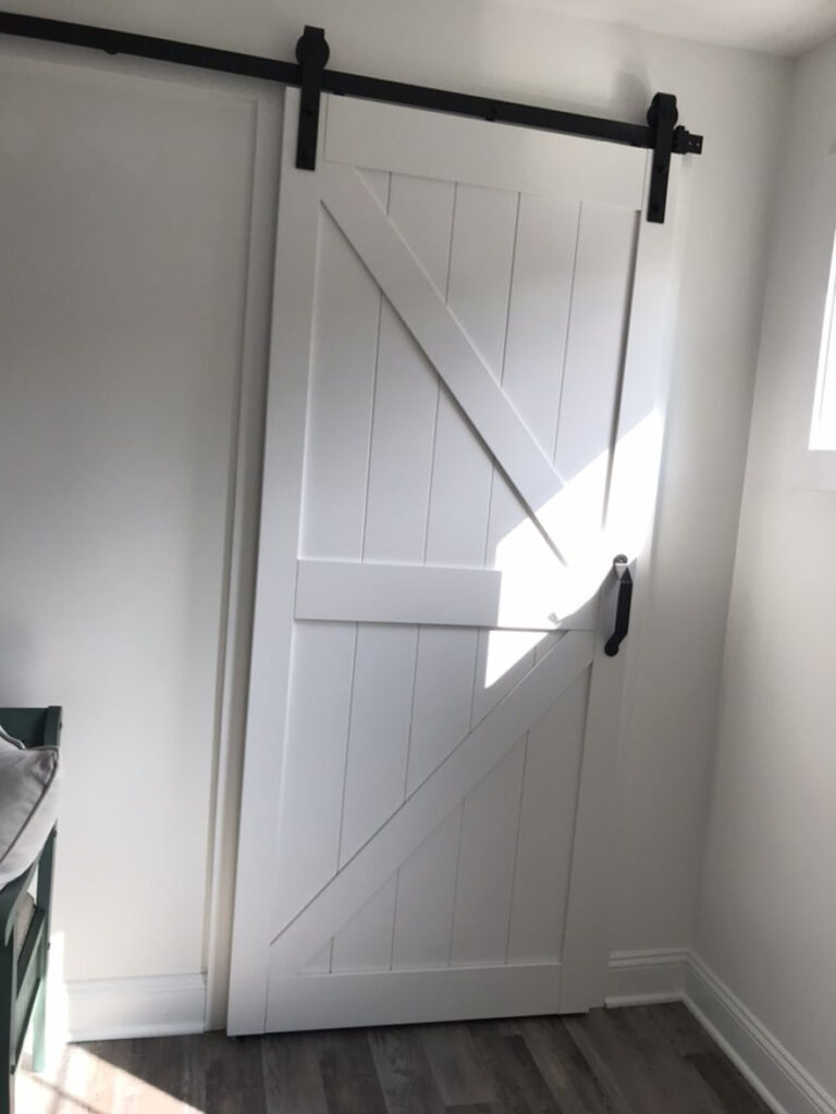 A white wooden sliding barn door.